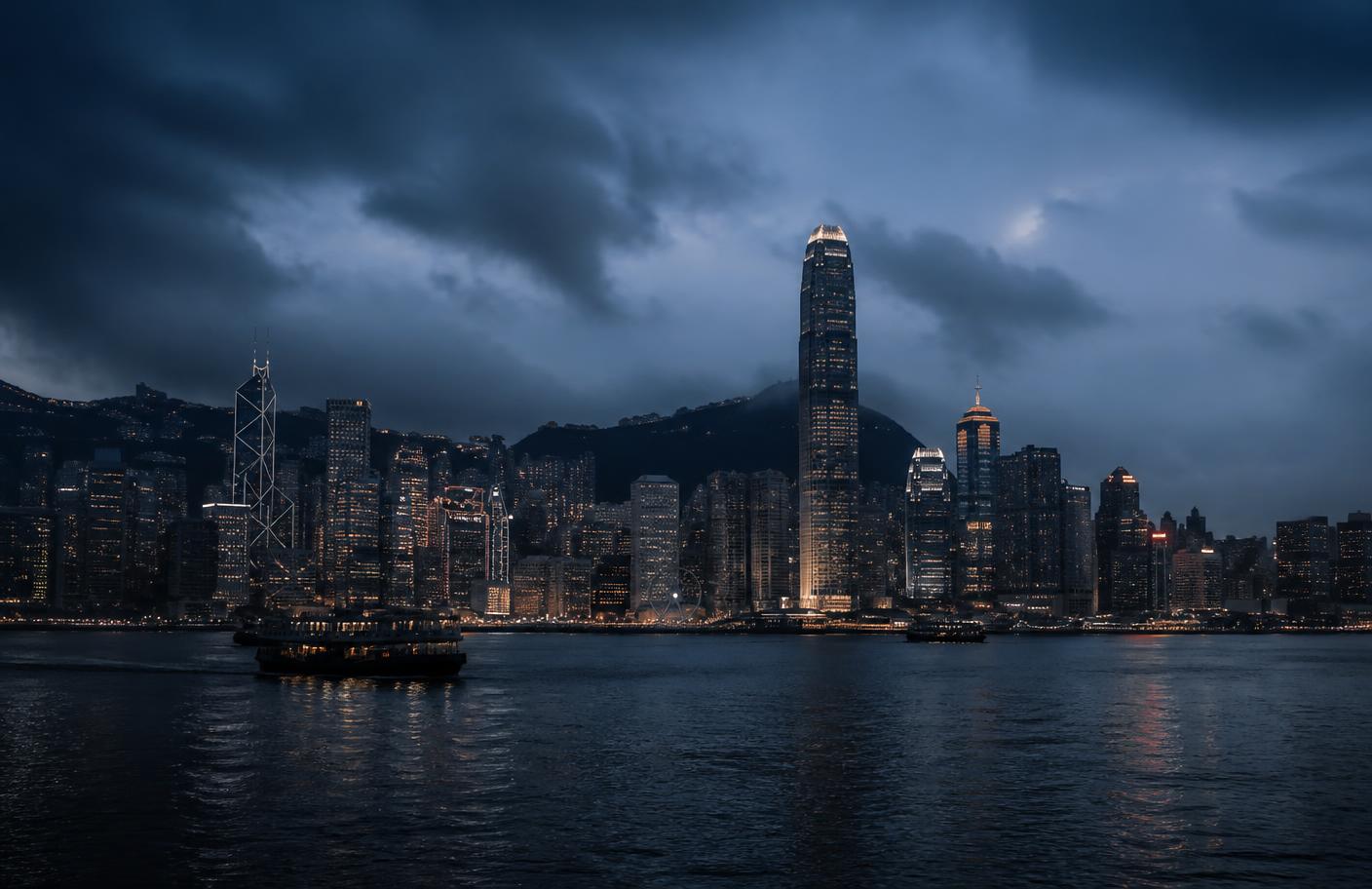 Hong Kong skyline at blue hour across Victoria Harbour